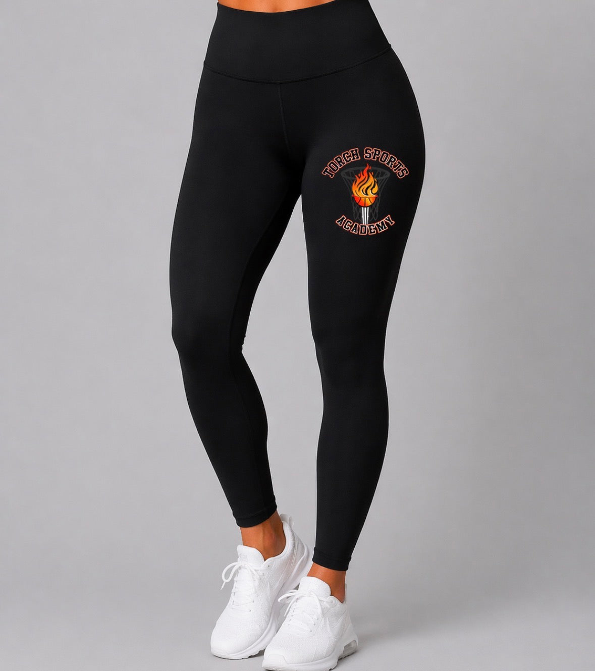 Black leggings with a logo on a gray background