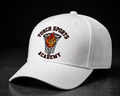 White cap with 'Torch Sports Academy' logo on a black background
